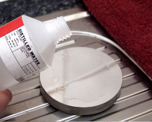 Flushing the mirror with distilled water